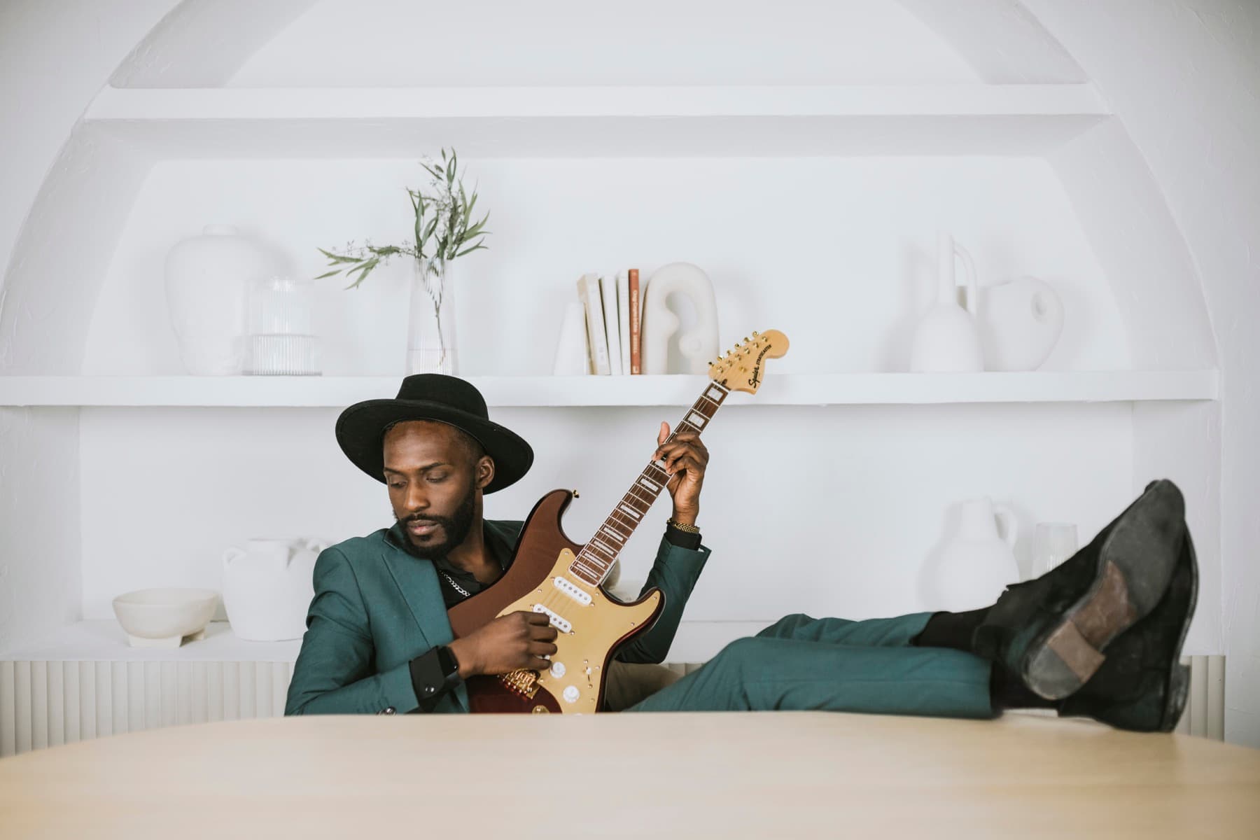 Almyr Jules playing guitar